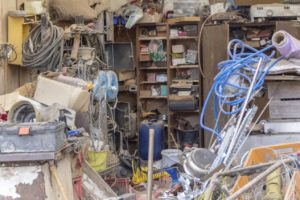 room full of mess and junk after natural disaster action restoration specialists